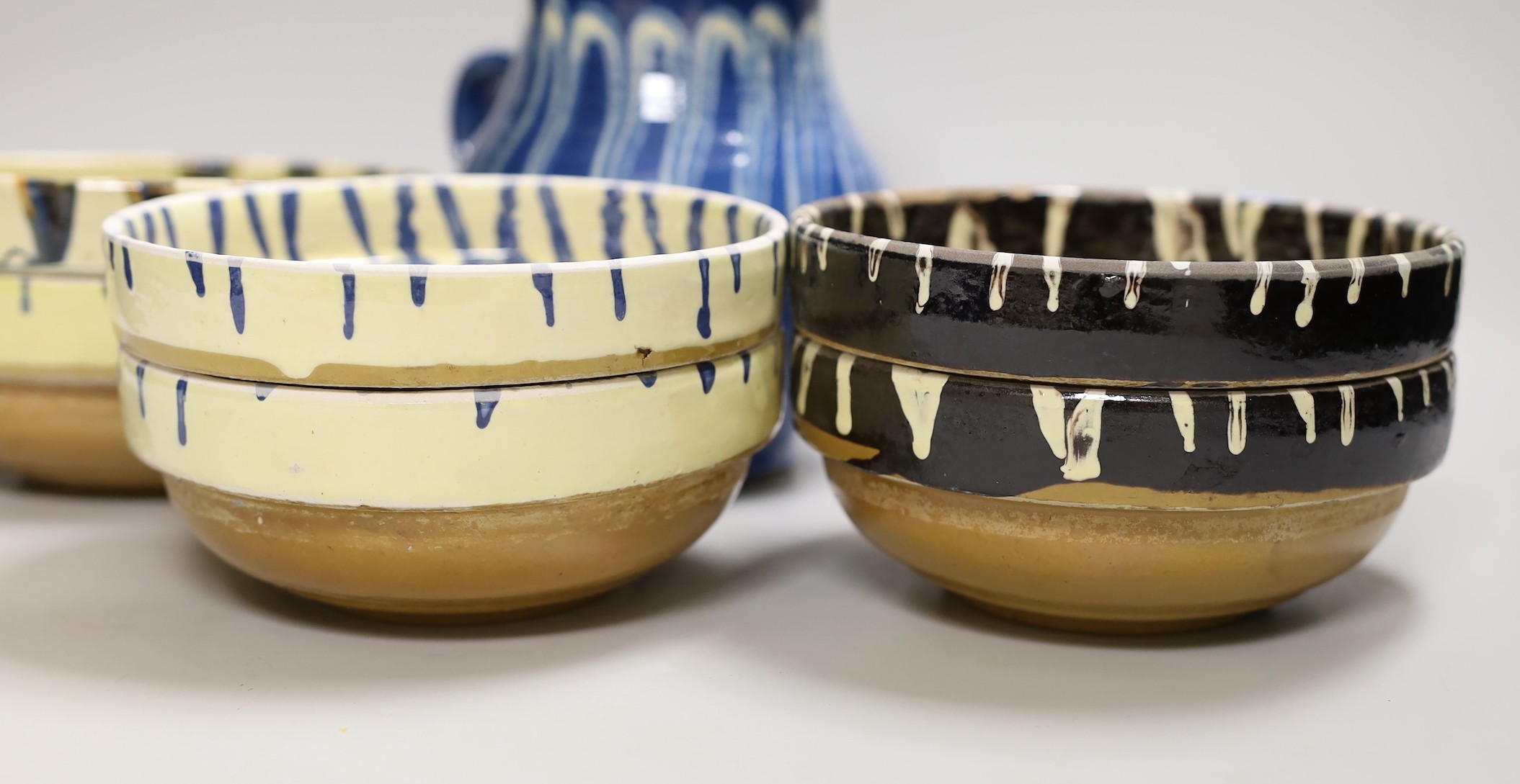 A group of six polychrome slipware bowls and a jug- 18cms high